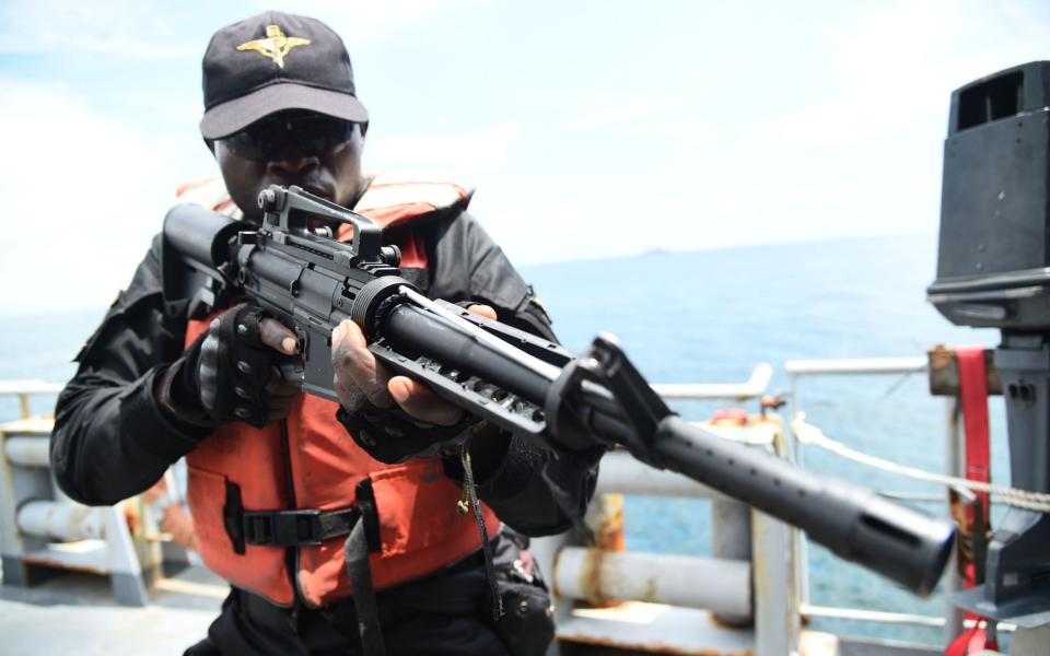 A Special Force of the Nigerian navy tries to arrest pirates in F735 Germinal French Frigate in a stage managed operations during the five-day joint military exercise between Nigeria and French navy - PIUS UTOMI EKPEI /AFP