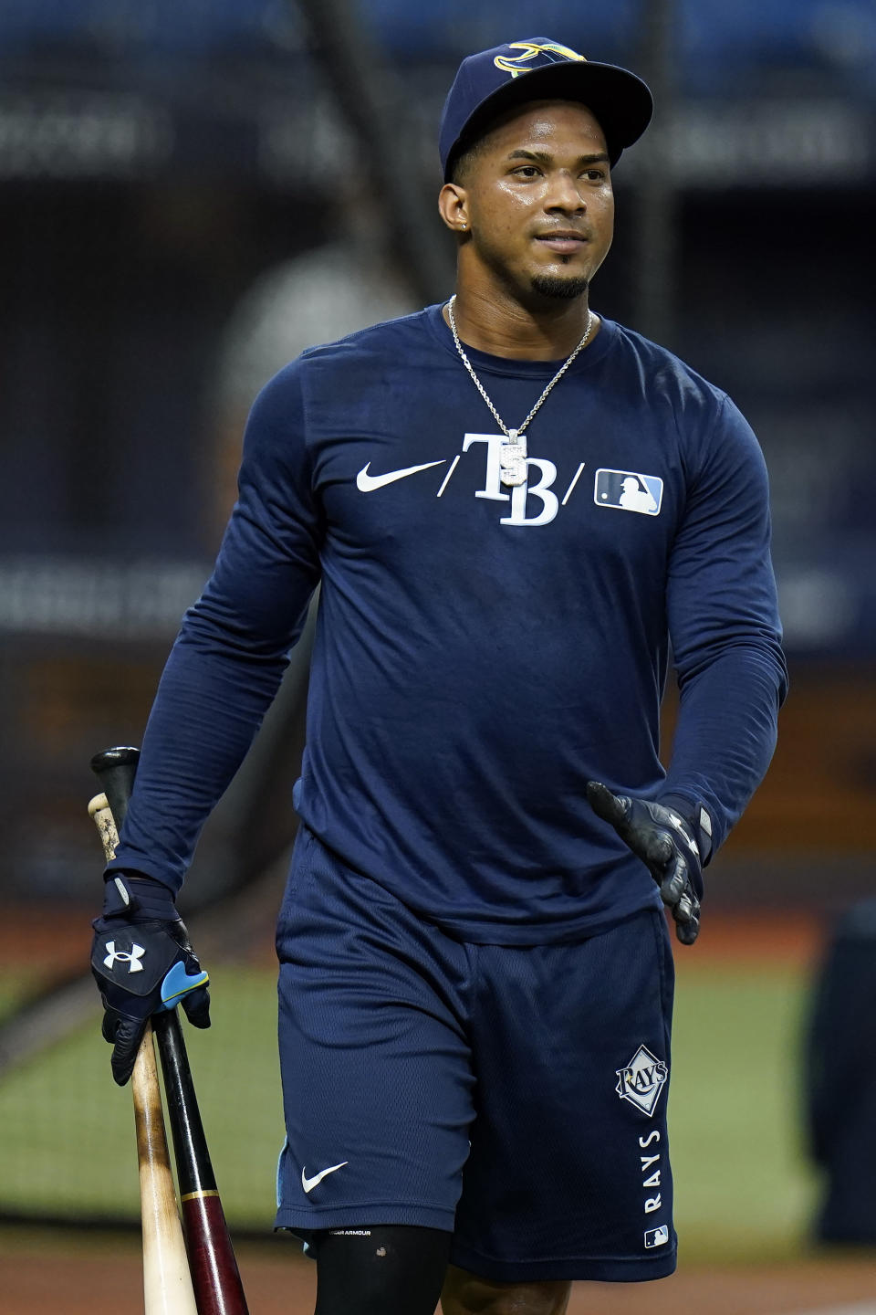 Tampa Bay Rays' Wander Franco carries his bats after taking batting practice before a baseball game against the Toronto Blue Jays Monday, Sept. 20, 2021, in St. Petersburg, Fla. Franco expects to rejoin the team next week after injuring his hamstring. (AP Photo/Chris O'Meara)