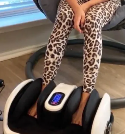 Woman with feet inside the Cloud massager.  (Photo: Amazon)