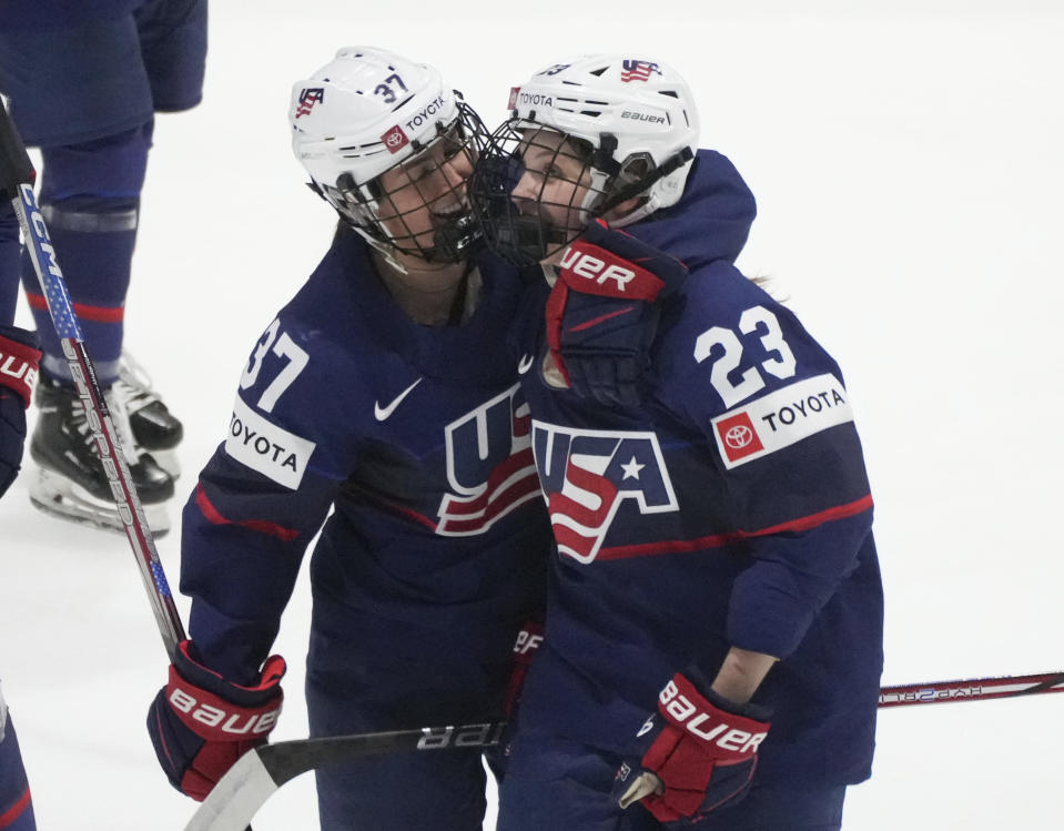 United States' Hannah Bilka (23) celebrates her goal with teammate Abbey Murphy (37) during the first period in the semifinals of the IIHF women's world hockey championships against Finland, Saturday, April 13, 2024, in Utica, N.Y. (Christinne Muschi/The Canadian Press via AP)