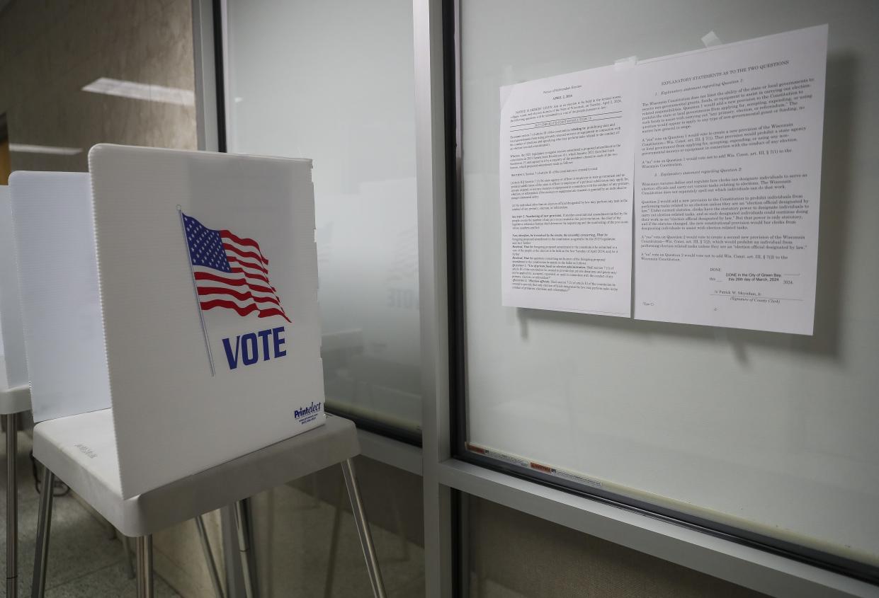 Notices explain referendum questions that are up for a public vote in the spring election are posted on Wednesday at City Hall in Green Bay. Early in-person absentee voting in Green Bay runs through noon Saturday.