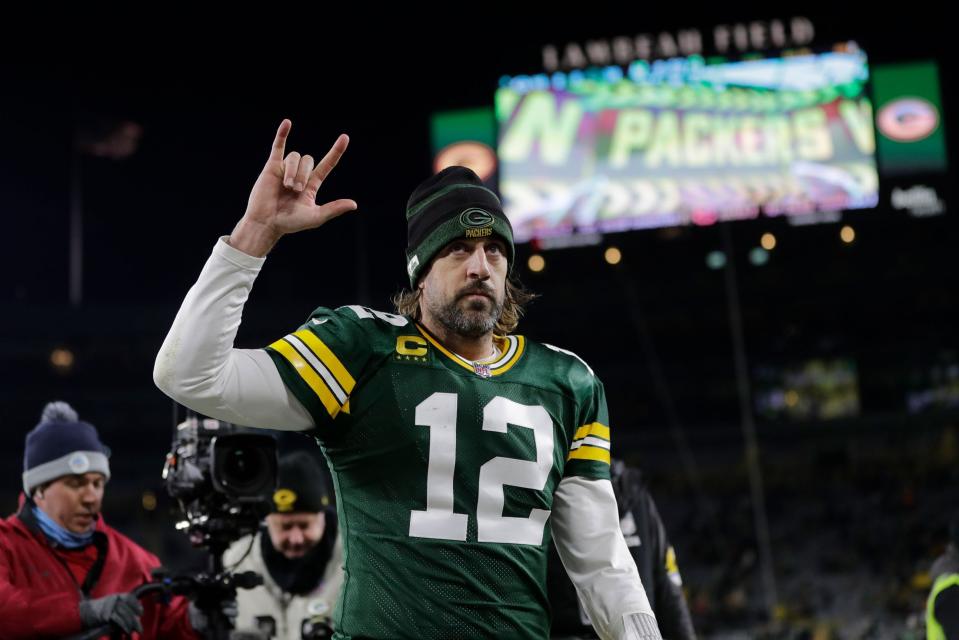 Aaron Rodgers walks off the field after a win against the Chicago Bears.