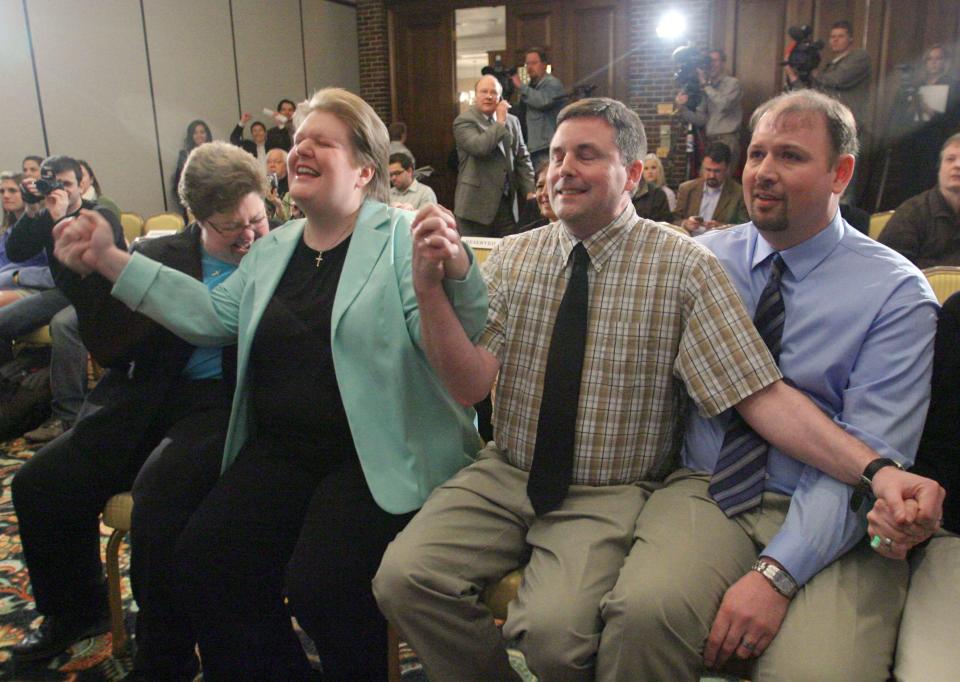 From left, plaintiffs Trish and Kate Varnum, of Cedar Rapids, and Jason Morgan and Chuck Swaggerty, of Sioux City, react to the Iowa Supreme Court ruling in favor of legalizing same-sex marriage during a press conference at Hotel Fort Des Moines in 2009.