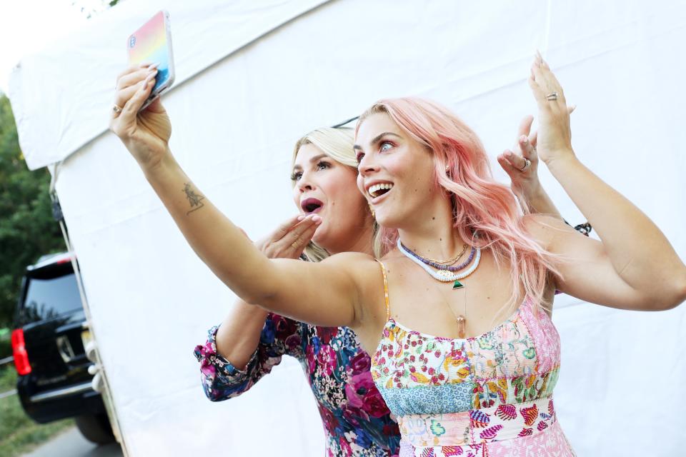 Heather McMahan and Busy Philipps pose for a selfie during Bustle's 2019 Rule Breakers Festival.