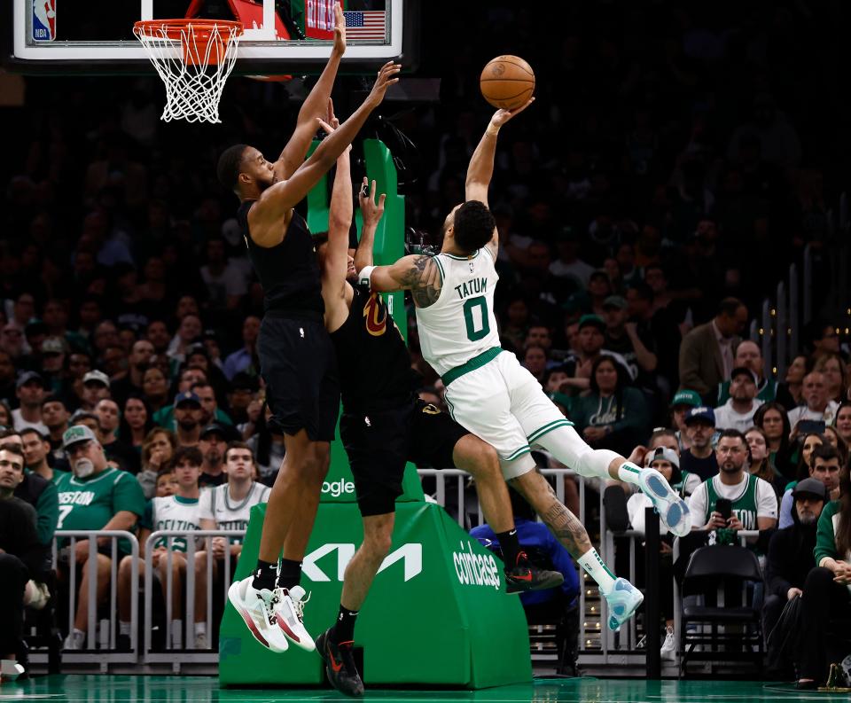 The Boston Celtics' Jayson Tatum (0) shoots against the Cleveland Cavaliers during Game 1 at TD Garden. The Celtics won the game, 120-95.