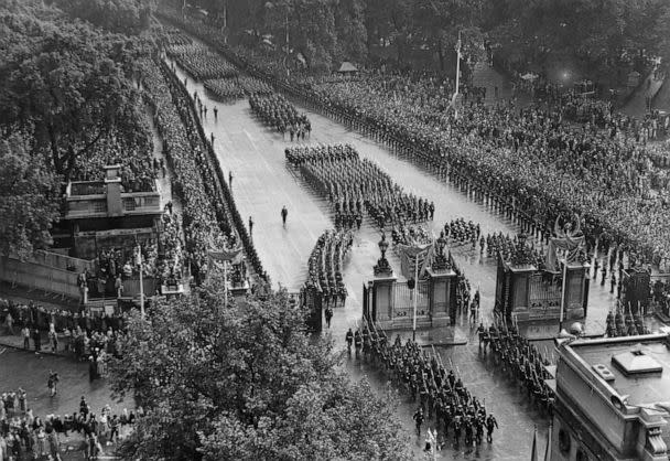 PHOTO: Crowds line South Carriage Drive, Hyde Park as Queen Elizabeth II's coronation procession passes, June 2, 1953, in London. (Central Press/Getty Images)