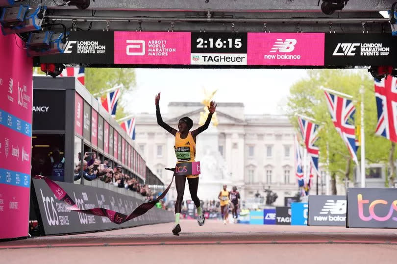 Peres Jepchirchir crosses the line to win the women's elite race and breaking the women's record