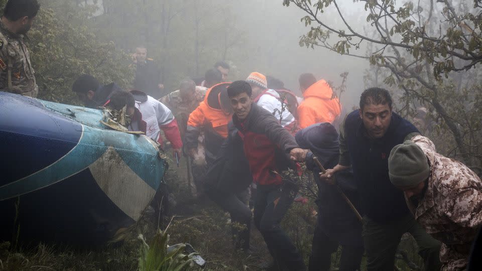 A photo provided by Moj News Agency shows rescue team workers at the scene of the helicopter crash on May 20, 2024. - Azin Haghighi/Moj News Agency/AP
