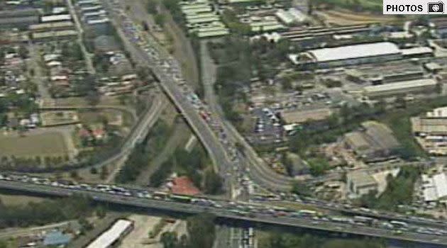 Gallery - Traffic is banked back six kilometres after an accident involving a truck and three cars at Auburn. Photo: 7News