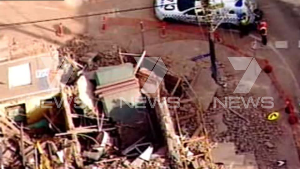 Police attend the site at a building wall collapse. Picture: 7 News