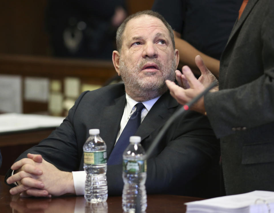 Harvey Weinstein talks to his lawyer during a court appearance at New York Supreme Court, Thursday, Dec. 20, 2018, in New York. Judge James Burke allowed his sexual assault case to move forward. (Alec Tabak/The Daily News via AP, Pool)