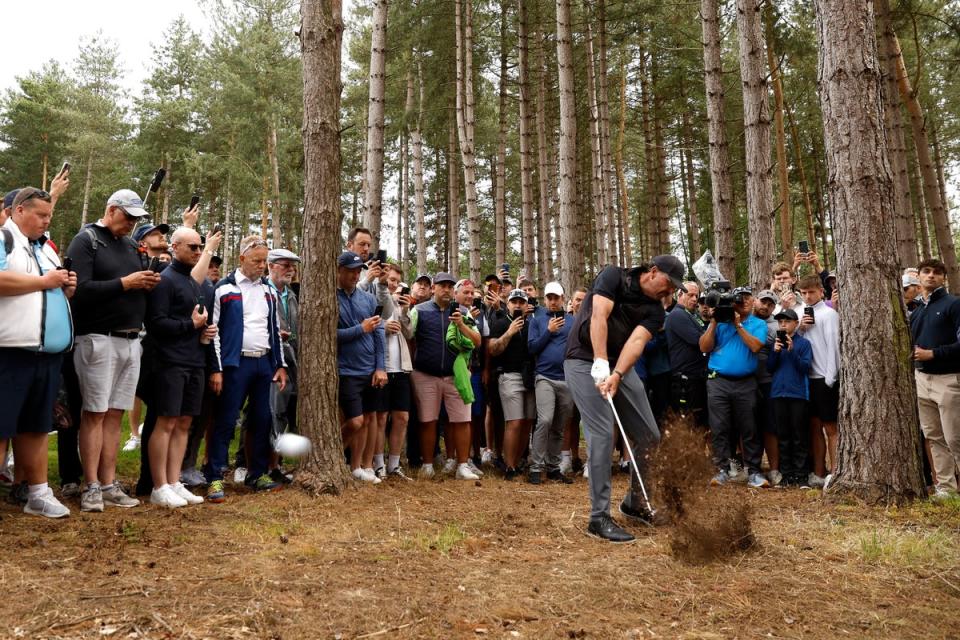 Mickelson plays out from the forest on hole three (PA)