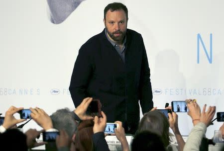 Journalists take pictures as director Yorgos Lanthimos attends a news conference for the film "The Lobster" in competition at the 68th Cannes Film Festival in Cannes, southern France, May 15, 2015. REUTERS/Regis Duvignau