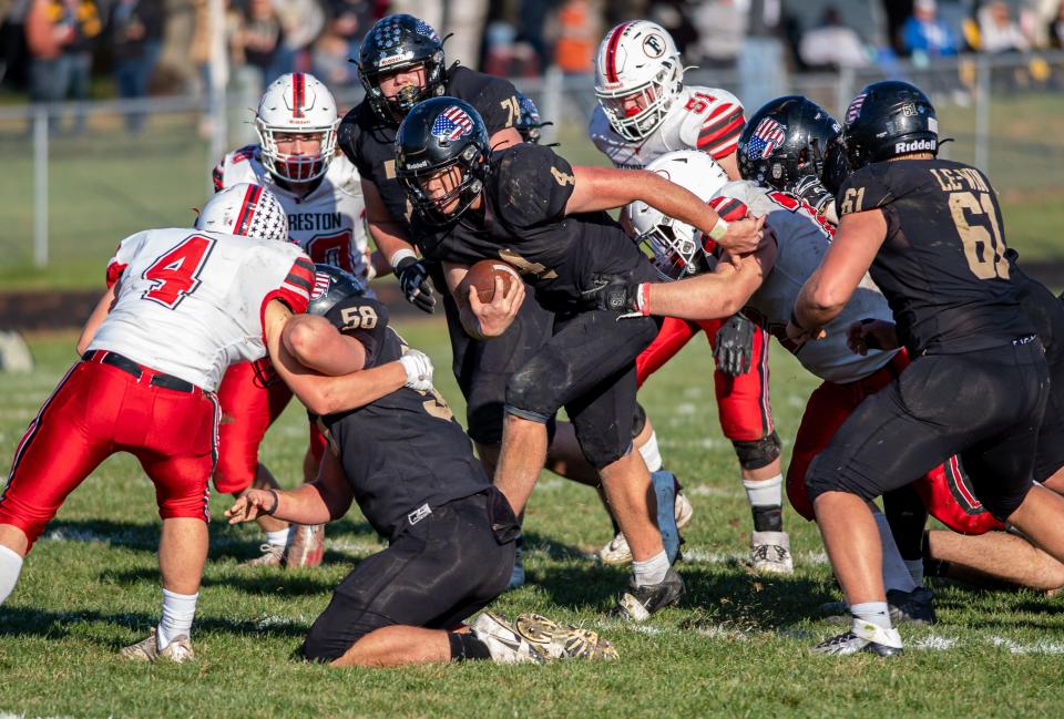 Lena-Winslow's Gage Dunker runs with the ball during the third quarter of the Class 1A playoff game on Saturday, Nov. 4, 2023, in Lena.