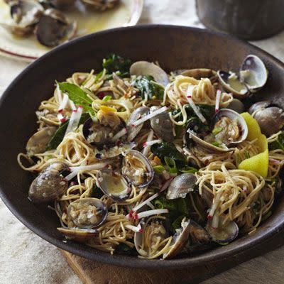 <p>This healthy version of spaghetti alle vongole uses wholewheat pasta, peppery radishes, clams and yep - you guessed it - fresh spinach.</p><p>Get the <a href="https://www.delish.com/uk/cooking/recipes/a28840719/angel-hair-pasta-clams-radishes-spinach-recipe-del0513/" rel="nofollow noopener" target="_blank" data-ylk="slk:Angel Hair Pasta with Clams, Radishes and Spinach;elm:context_link;itc:0;sec:content-canvas" class="link ">Angel Hair Pasta with Clams, Radishes and Spinach</a> recipe.</p>