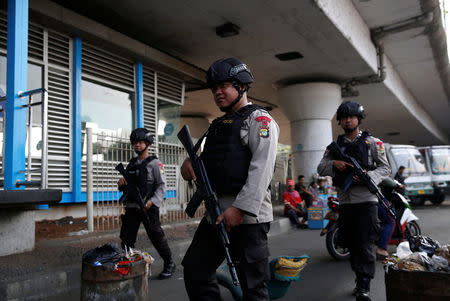 Police patrol near the scene of an explosion at a bus station in Kampung Melayu, Jakarta, Indonesia May 25, 2017. REUTERS/Darren Whiteside