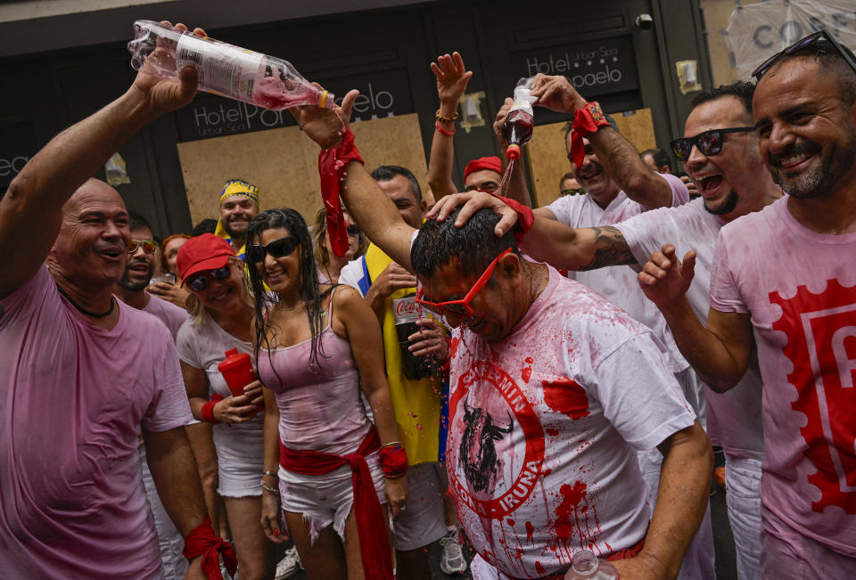 Revellers gather for the 'Chupinazo' rocket, which marks the official opening of the 2023 San Fermín fiestas in Pamplona, Spain, Thursday, July 6, 2023. (AP Photo/Alvaro Barrientos)