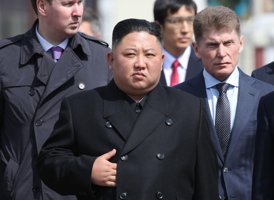 Kim Jong-un watches an honour guard before his departure to North Korea at the railway station in Vladivostok, Russia.