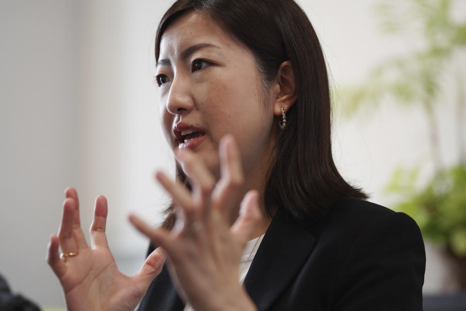 Lawyer Akiko Ozawa, whose law firm advises job-leavers although usually it represents companies, speaks during an interview with The Associated Press on June 22, 2023, in Tokyo. In Japan, a nation reputed for loyalty to companies and lifetime employment, people who job-hop are often viewed as quitters. Ozawa has written a book on job-leaving services to help various people, mostly in their 20s and 30s, escape less painfully from jobs they want to quit. (AP Photo/Eugene Hoshiko)