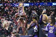 LSU head coach Kim Mulkey holds up the championship trophy after the NCAA Women's Final Four championship basketball game against Iowa Sunday, April 2, 2023, in Dallas. LSU won 102-85 to win the championship. (AP Photo/Darron Cummings)