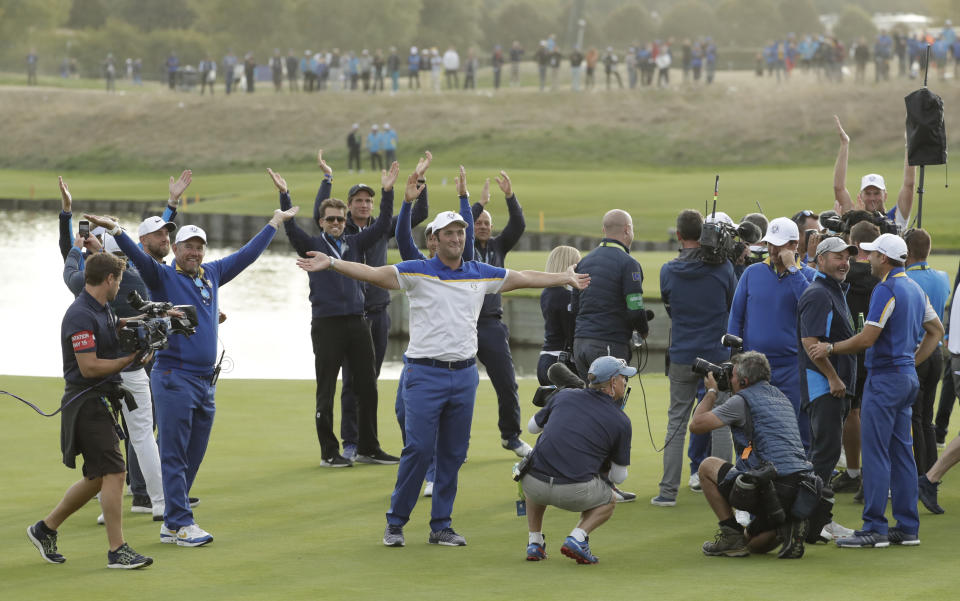 Europe's Jon Rahm, center, celebrates after Europe won the Ryder Cup on the final day of the 42nd Ryder Cup at Le Golf National in Saint-Quentin-en-Yvelines, outside Paris, France, Sunday, Sept. 30, 2018. (AP Photo/Matt Dunham)