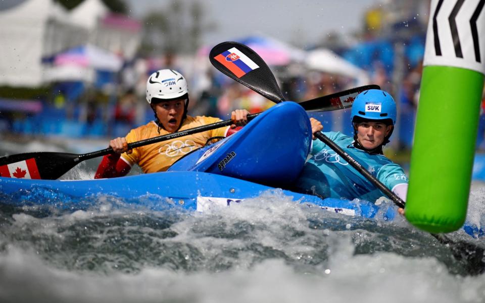 Two kayak cross racers collide