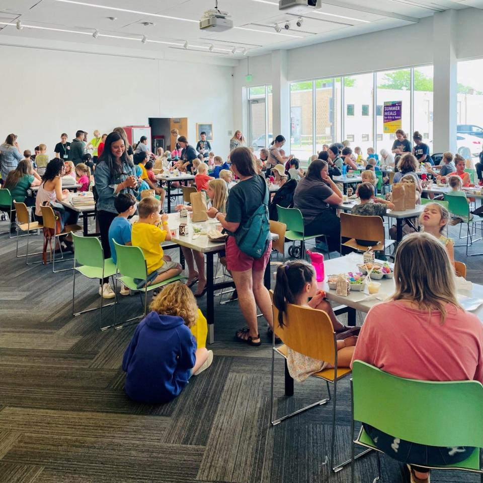 Ames youth have a free meal at the Ames Public Library in 2023.