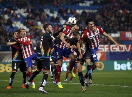 Football Soccer - Atletico Madrid v Rayo Vallecano - Spain King's Cup- Vicente Calderon stadium, Madrid, Spain - 14/1/16 Atletico Madrid's Diego Godin and Stefan Savic in action with Rayo Vallecano's Joaquin Jose Marin "Quini" and Jose Ignacio Martinez "Nacho". REUTERS/Susana Vera TPX IMAGES OF THE DAY