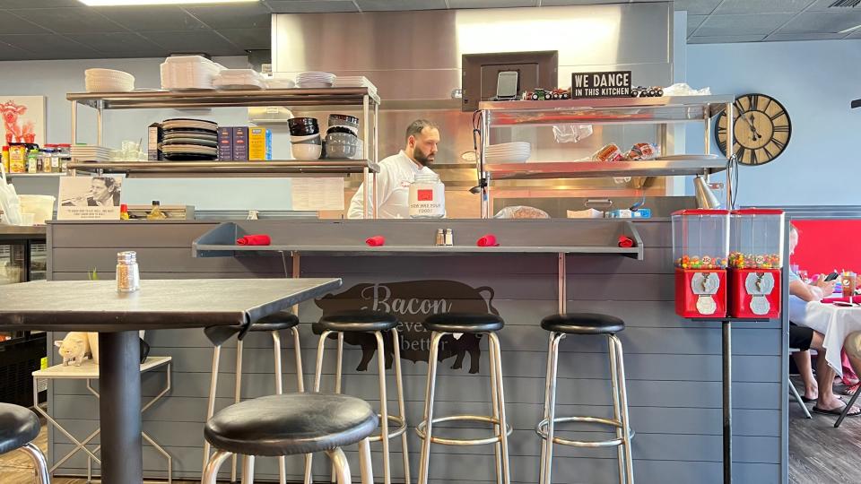 At Cochon Cafe in Stuart, a sign reads, 'We dance in this kitchen.' Chef Joseph Syngjellari dances by singularly preparing all of the food with skill and to order.