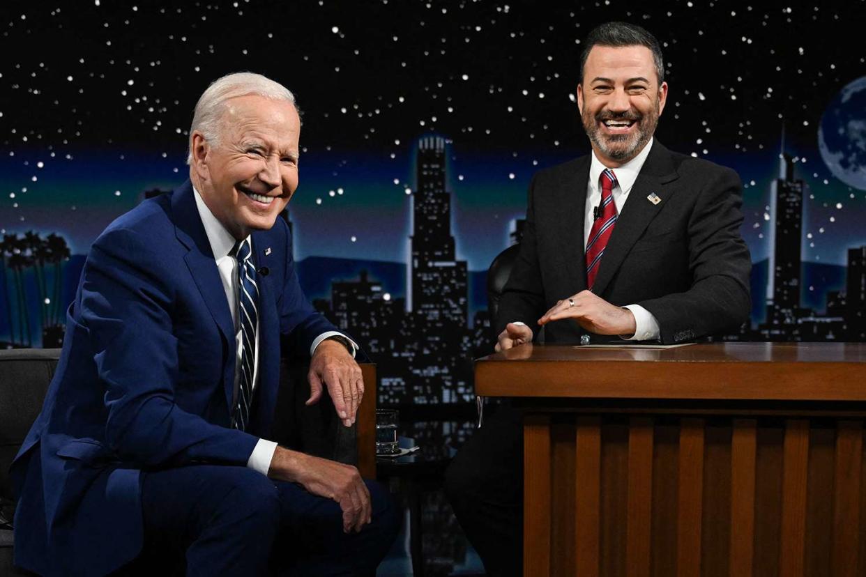 US President Joe Biden sits next to host Jimmy Kimmel as he makes his first in-person appearance on 