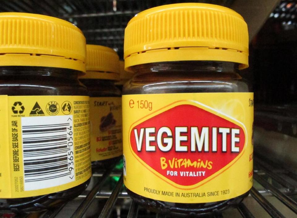 Vegemite are sold at a supermarket in Canberra, Australia, Thursday, Jan. 19, 2017. The salty, brown spread beloved in Australia, is going home, purchased by an Australian dairy company from the maker of Oreos. Mondelez International Inc. says it is selling Vegemite and other Australian and New Zealand grocery products to Bega Cheese in a deal worth about $345.3 million (460 Australian dollars). (AP Photo/Rod McGuirk)