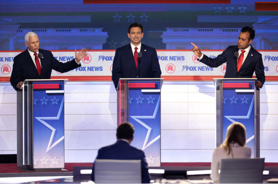 Former Vice President Mike Pence, Florida Gov. Ron DeSantis and Vivek Ramaswamy participate in the first debate of the GOP primary season hosted by Fox News at the Fiserv Forum on Aug. 23, 2023, in Milwaukee, Wisconsin. / Credit: Win McNamee/Getty Images