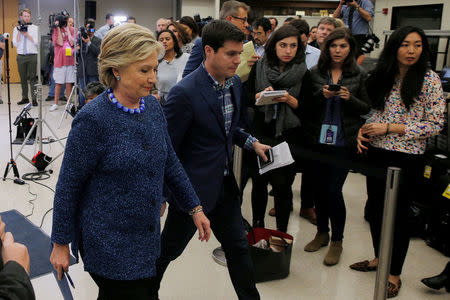 U.S. Democratic presidential nominee Hillary Clinton leaves after an unscheduled news conference on FBI inquiries about her emails after a campaign rally in Des Moines, Iowa, U.S. October 28, 2016. REUTERS/Brian Snyder