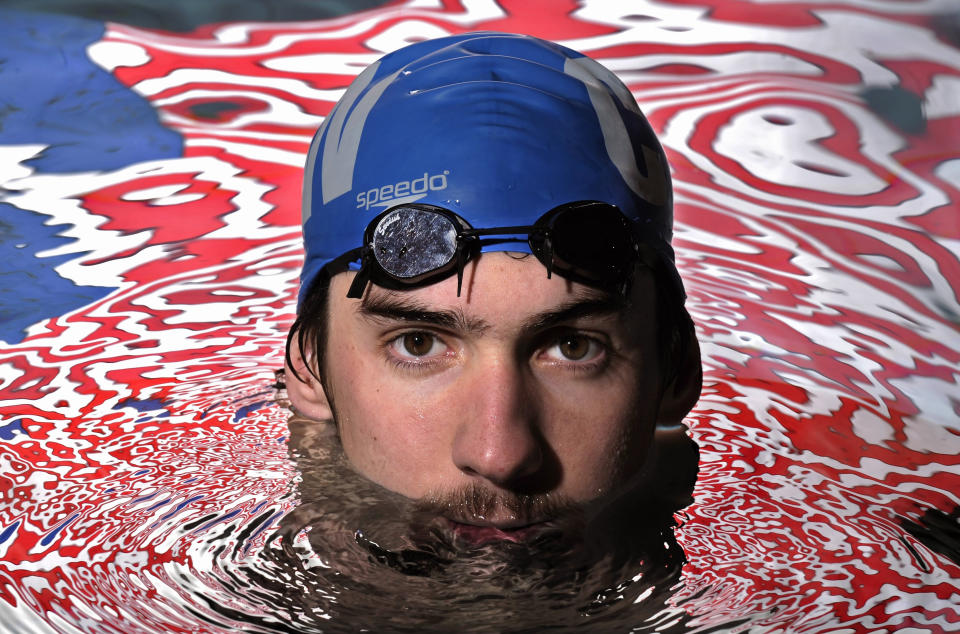 FILE - Olympic gold medalist Michael Phelps poses in the Belmont Plaza Olympic Pool in Long Beach, Calif., Jan. 18, 2008. Almost any Olympic athlete can tell you where the spark was lit to push them into sports. For many, it was in front of a TV set as a kid, watching the Summer Games play out in some faraway place — and often, Michael Phelps was the athlete that drew their interest. (AP Photo/Mark J. Terrill/File)
