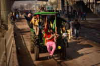 DELHI, INDIA - 2021/01/26: Farmers' Tractors Parade at the Tikri border during the demonstration. Farmers protesting against agricultural reforms breached barricades and clashed with police in the capital on the India's 72nd Republic Day. The police fired tear gas to restrain them, shortly after a convoy of tractors trundled through the Delhi's outskirts. (Photo by Manish Rajput/SOPA Images/LightRocket via Getty Images)