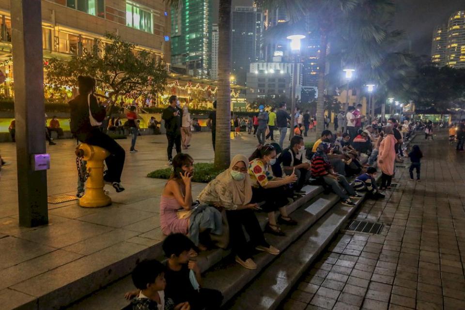 People celebrate New Year’s Eve at the KLCC park in Kuala Lumpur, December 31, 2020. — Picture by Firdaus Latif