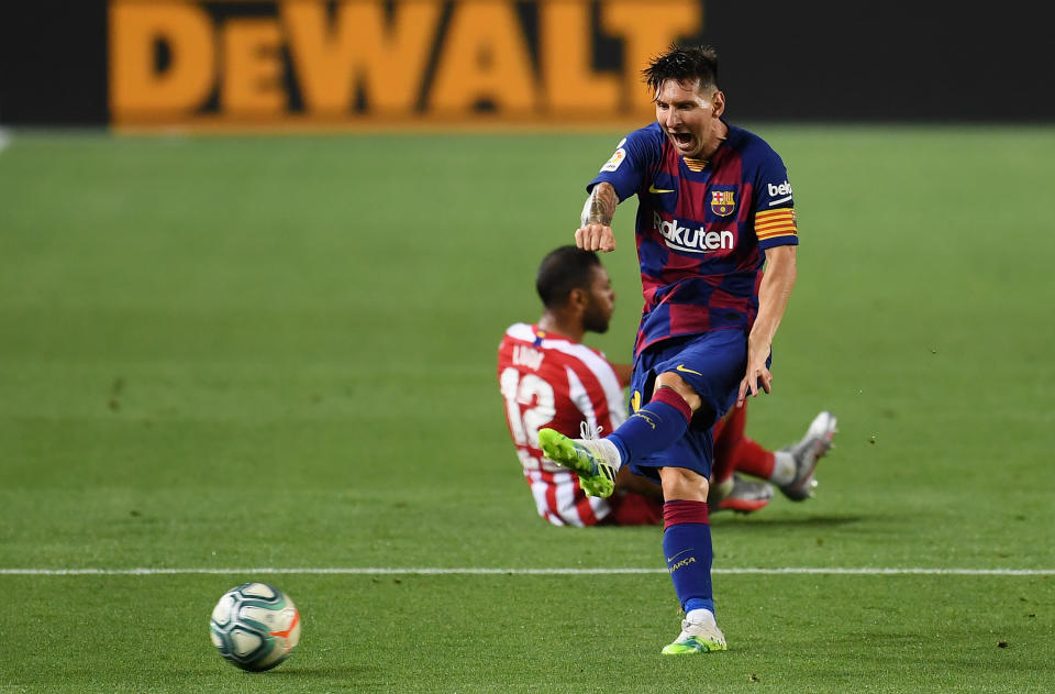 Lionel Messi's milestone 700th goal was not enough to help Barcelona beat Atletico Madrid and stem its slide. (Photo by David Ramos/Getty Images)