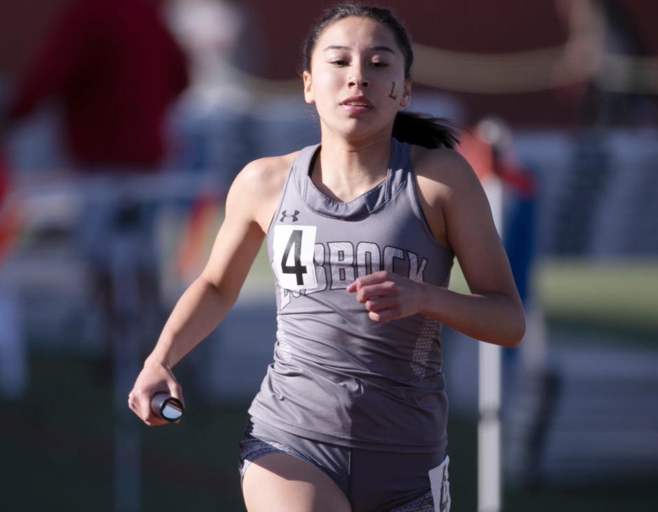 Lubbock High's Elizabeth Florez competes in the 1,600-meter relay in the Districts 3/4-5A area track and field meet Friday.