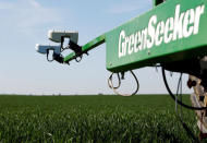 Optical sensors, Trimble Navigation Ltd’s 'GreenSeeker' devices to instantly adjust nitrogen fertilization, are seen installed at a tractor in a wheat field in the Bavarian town of Irlbach near Deggendorf, Germany, April 21, 2016. REUTERS/Michaela Rehle