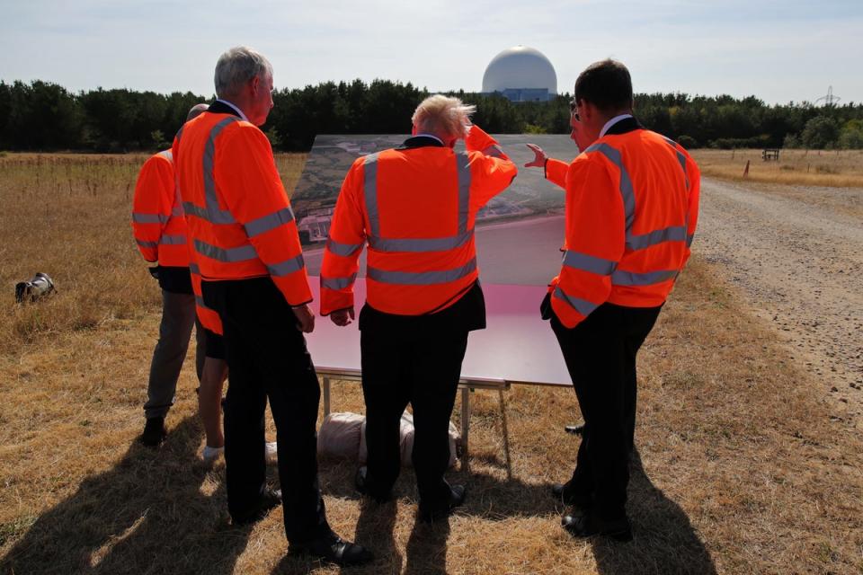 Mr Johnson (centre) looks at plans for the Sizewell C nuclear power station project (Chris Radburn/PA) (PA Wire)