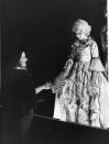 <p>During World War II, Princess Elizabeth and Princess Margaret were taken to Windsor Castle, while their parents stayed behind in Buckingham Palace. It was there that Margaret proposed putting on a Christmas pantomime. Here, Elizabeth is dressed as Cinderella, as her mother hands her a fan. </p>