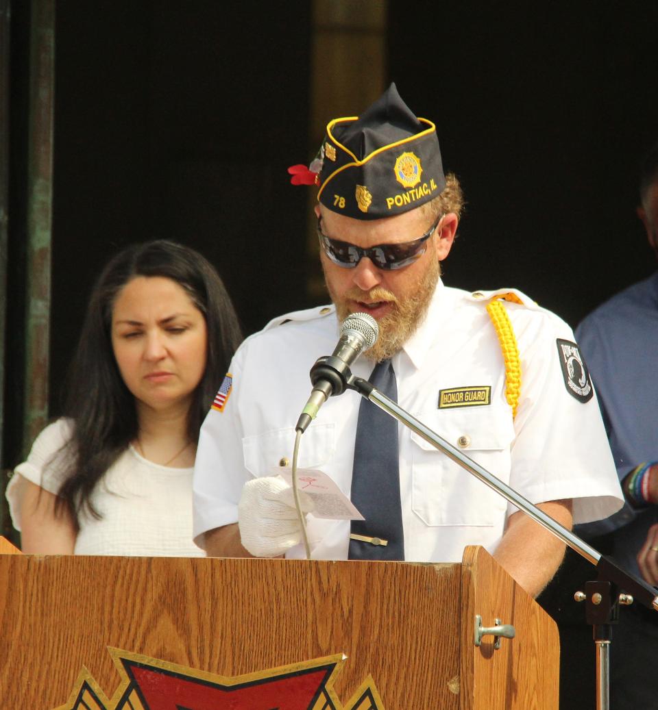 American Legion/VFW Commander Chris Saylor reads the American Response to Flanders Fieldat Monday's memorial Day service at Southside Cemetery.