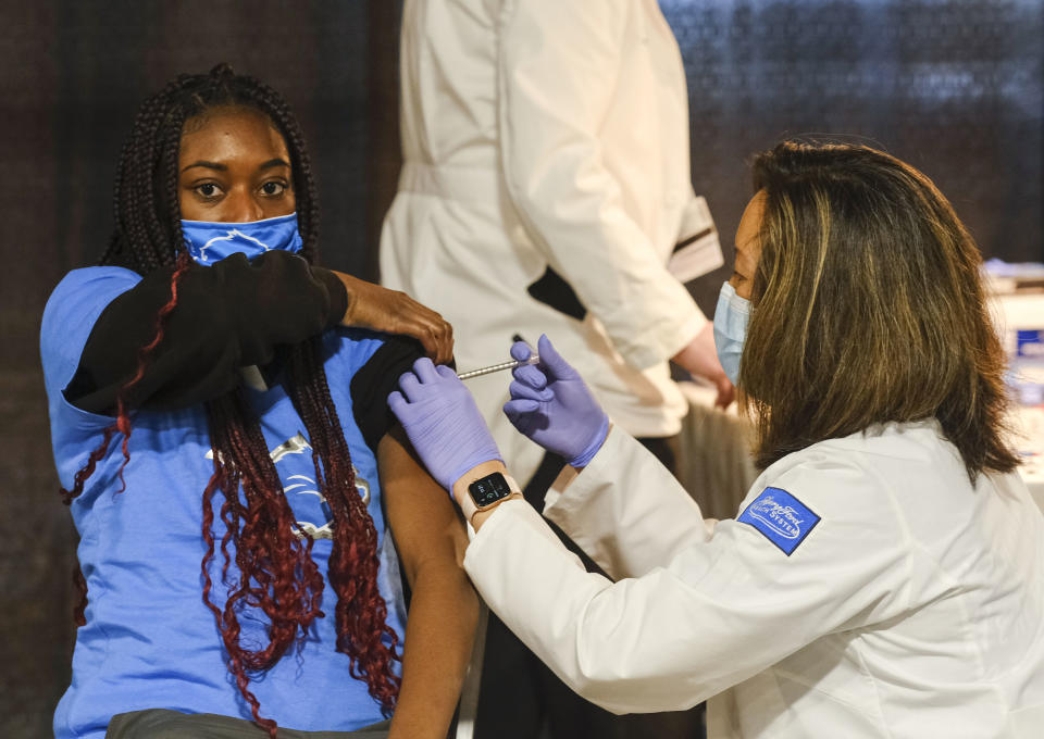 DETROIT, MI - APRIL 06: A group of teenagers serving as 'Covid-19 Student Ambassadors' joined Governor Gretchen Whitmer to receive a dose of the Pfizer Covid vaccine at Ford Field during an event to promote and encourage Michigan residents to go and get their vaccines on April 6, 2021 in Detroit, Michigan. As the US reaches a milestone in vaccinations, a surge of new Covid-19 cases has swept through the US with Michigan seeing the highest numbers of new cases. (Photo by Matthew Hatcher/Getty Images)