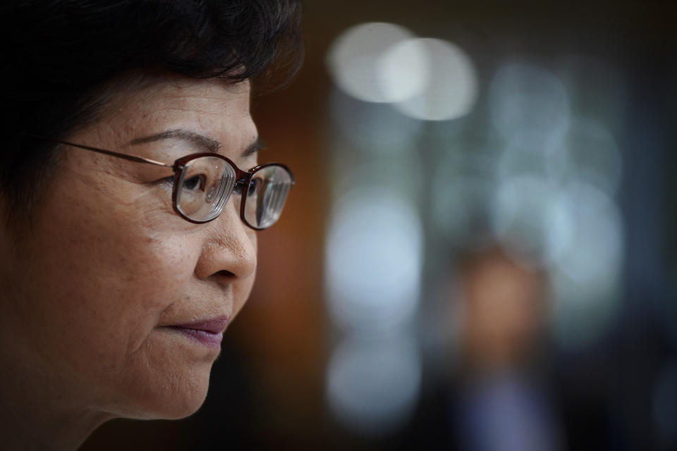Hong Kong Chief Executive Carrie Lam listens to a reporter's question during a press conference in Hong Kong, Tuesday, Nov. 26, 2019. Lam has refused to offer any concessions to anti-government protesters after a local election setback. (AP Photo/Vincent Yu)