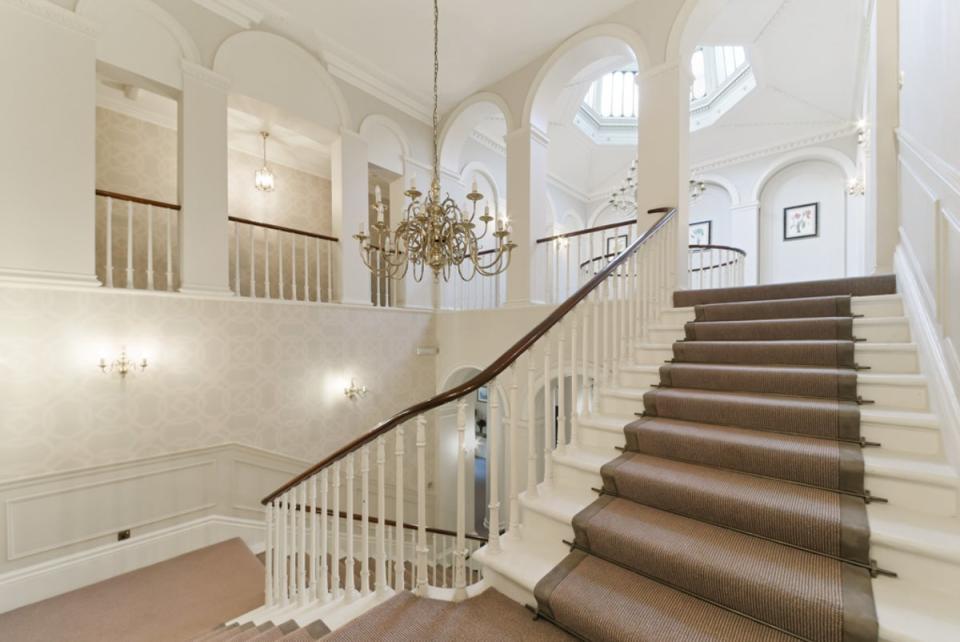 A sweeping staircase connects the entrance hall with the gallery and cupola (Barnard Marcus)