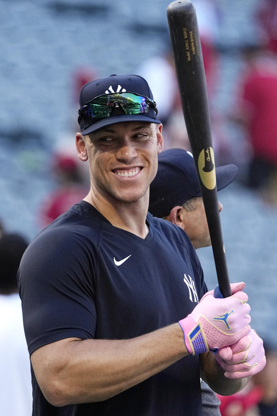New York Yankees' Aaron Judge, left, smiles during batting practice as manager Aaron Boone stands by prior to a baseball game against the Los Angeles Angels Tuesday, July 18, 2023, in Anaheim, Calif. (AP Photo/Mark J. Terrill)