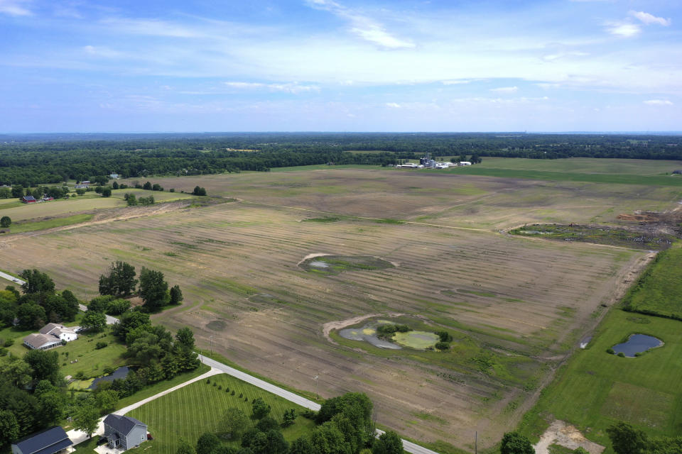 FILE - This aerial image taken with a drone on June 8, 2022, shows a portion of land in Johnstown, Ohio, where Intel plans to build two new processor factories. Intel’s announcement of the $20 billion manufacturing operation bringing thousands of jobs to central Ohio has been greeted as an economic boon. But it has also raised concerns about the impact on a region already suffering a housing shortage. (AP Photo/Gene J. Puskar, File)