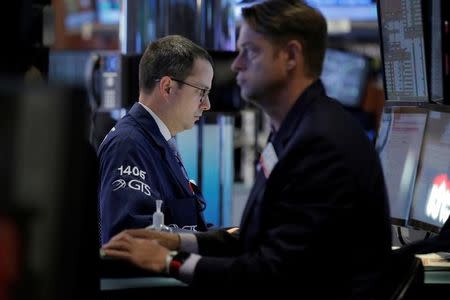 Traders work on the floor of the New York Stock Exchange (NYSE) in New York City, U.S., May 25, 2016. REUTERS/Brendan McDermid