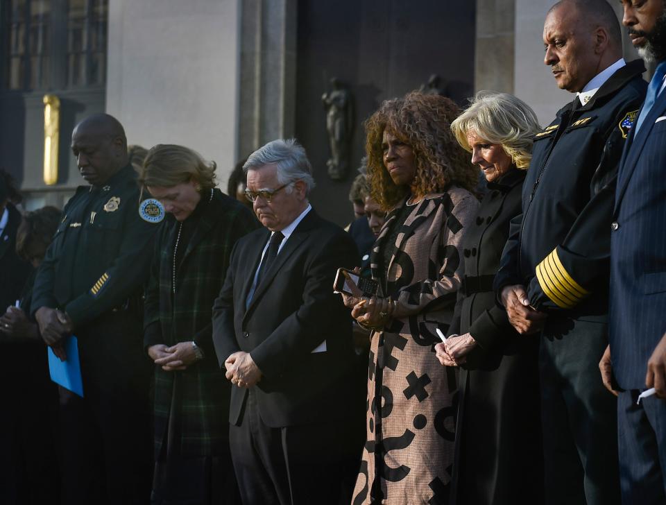 Metro Police Chief John Drake, Laura Fitzgerald Cooper, Mayor John Cooper, Deputy Mayor Brenda Haywood, First Lady Dr. Jill Biden and Nashville Fire Chief William Swan, pray during the Nashville Remembers candlelight vigil to mourn and honor the victims of The Covenant School mass shooting at Public Square Park Wednesday, March 29, 2023 in Nashville, Tenn. 