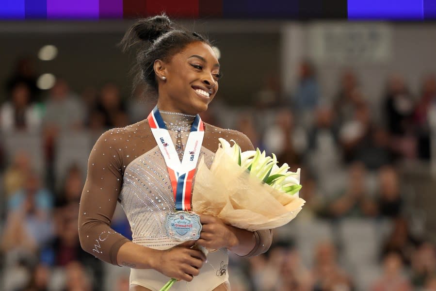 FORT WORTH, TEXAS – JUNE 02: First place all around winner Simone Biles celebrates after the 2024 Xfinity U.S. Gymnastics Championships at Dickies Arena on June 02, 2024 in Fort Worth, Texas. (Photo by Elsa/Getty Images)